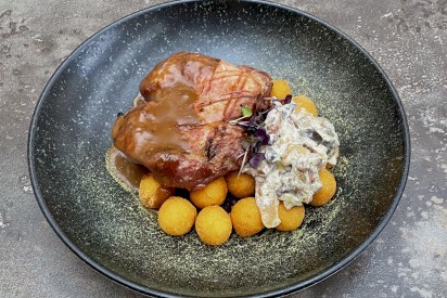 Grilled pork neck with mushrooms and mini potatoes