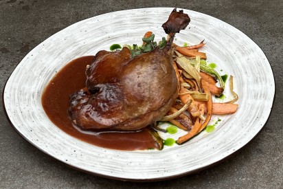 Teriyaki duck confit with carrot, celery and cranberry ju sauce